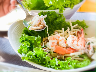 Green salad mixed with coconut spicy with shrimp Vietnam food style food backgrounds