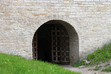Entrance door into Gate Tower of stone fortress Staraya Ladoga, Russia.