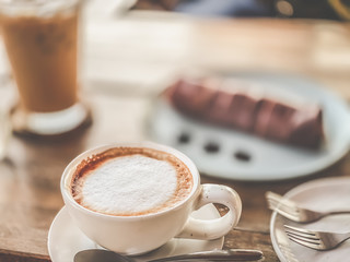 Cappuccino hot drink on wood table cafe interior backgrounds