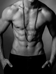 Fototapeta na wymiar Muscular fit male body , black and white photo 