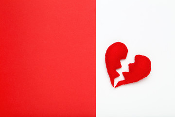 Fabric broken hearts on colorful paper background