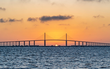 Fototapeta na wymiar Bridge as the sun rises in the Gulf of Mexico