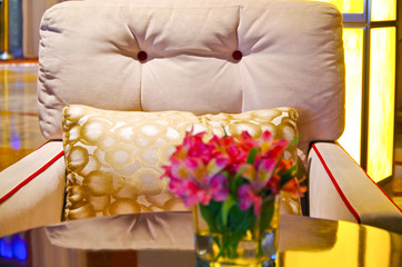 Elegant Art deco style interior design of lounge, bar coffee shop with armchairs and flower...