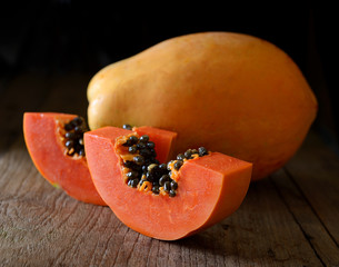 Papaya on wooden background.