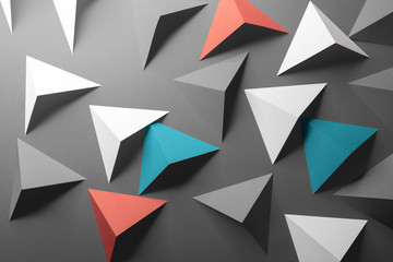 Abstract pattern made of colored paper, gray background
