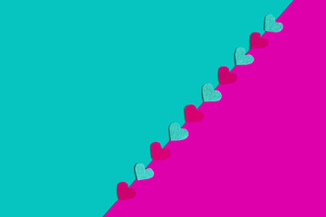 Pink and green background with felt hearts. Valentine's card. Copy space. Place for text and design.