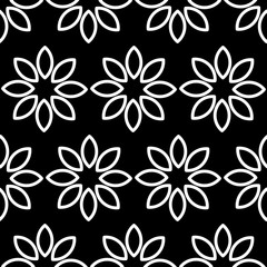 Geometric traditional white floral seamless pattern. Black background. Perfect for fabric designs, tiles,wallpaper, pattern fills, backgrounds,surface textures.