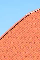 The roof of corrugated sheet red orange
