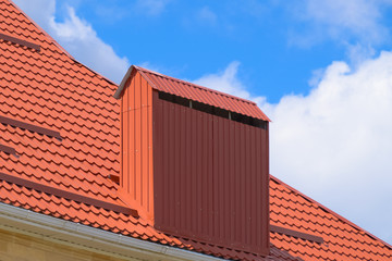 The roof of corrugated sheet red orange