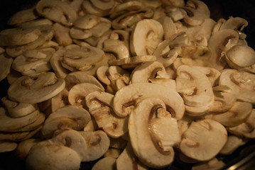 lot of sliced mushroom cooking in the pan