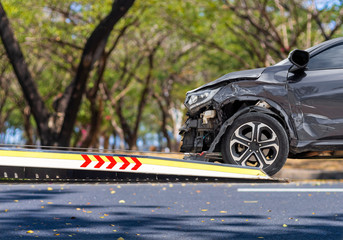 accident Car Slide on  truck for move. Balck car have damage by accident on road take with slide...