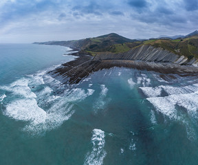 Zumaia and Deba flysch geological strata layers drone aerial view, Basque Country