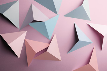 Fototapeta premium Abstract pattern made of colored paper, pink background