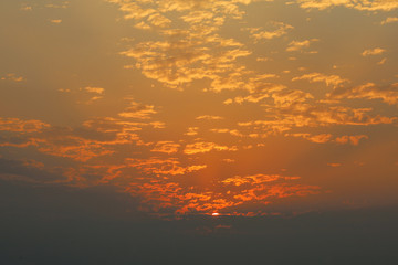 Red and orange light on cloud before sunset on the sea at thailand