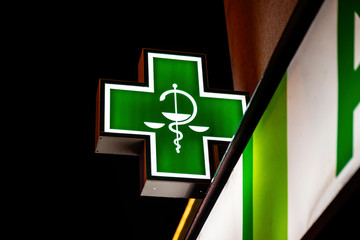 Symbol of pharmaceuticals and pharmacies in European countries green cross.