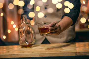 Barman pouring whiskey whiskey glass beautiful night