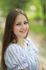 A girl in a spring green park