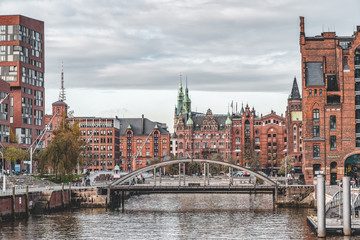 Speicherstadt red brick houses and Busanbrucke bridge in Hafenci in Hamburg, Germany