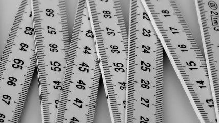 measuring tool folding wooden black and white close-up