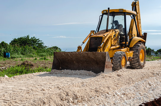 Tractor Leveling Marl On Road Construction Site