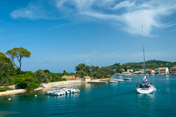 A sailing boat enters the port of Gaios.