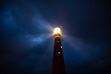lighthouse at night © Olha Rohulya