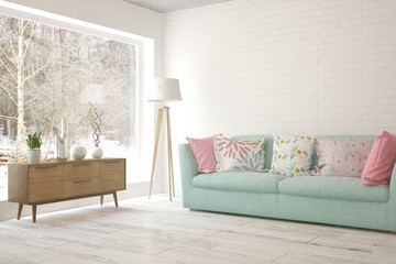 Stylish room in white color with sofa and winter landscape in window. Scandinavian interior design. 3D illustration