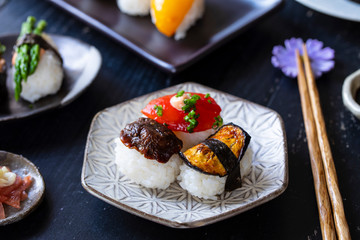 Vegan sushi with tomato, mushroom and asparagus