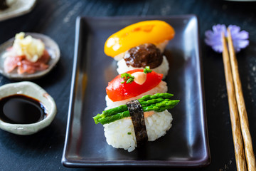 Vegan sushi with tomato, mushroom and asparagus