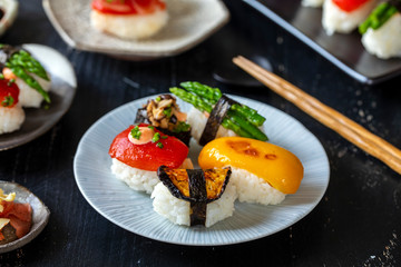 Vegan sushi with tomato, mushroom and aubergine