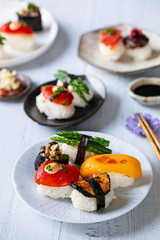 Vegan sushi with tomato, mushroom and aubergine
