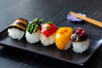 Vegan sushi with tomato, mushroom and aubergine