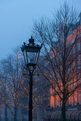 Fototapeta na wymiar Amsterdam Lamp and Christmas Lights