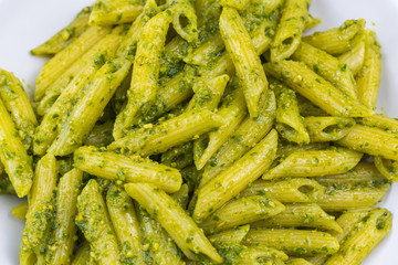 Cooked home made linguine pasta with pesto sauce. 