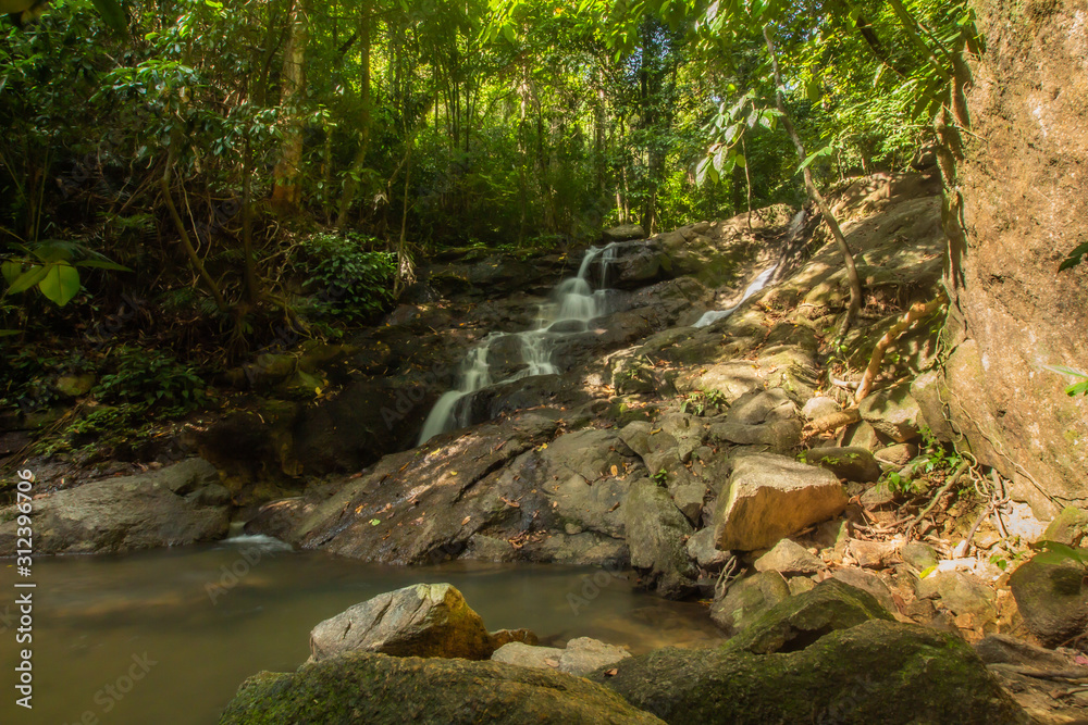 Canvas Prints kathu waterfall in the tropical forest area in asia, suitable for walks, nature walks and hiking, ad