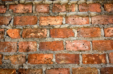 Old brick wall background. Close up of rustic brickwork of old building.
