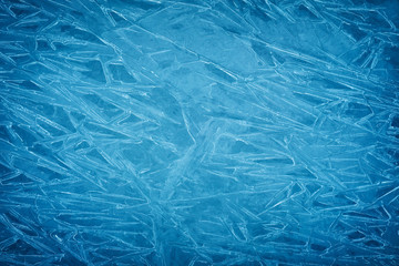 Background of blue cold winter ice. Texture of frozen surface. Frost pattern