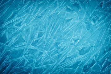 Background of blue cold winter ice. Texture of frozen surface. Frost pattern