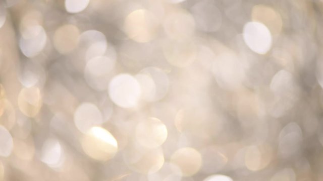 Silver abstract bokeh lights. Festive defocused background. New year and Christmas concept. Greeting card