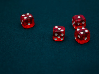 red Dices on green casino table