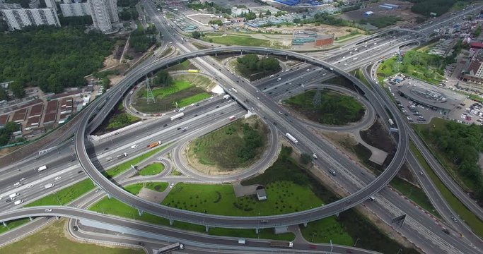 Aerial shot of transport traffic on large two level intersection with roundabout. Kashira Highway in Moscow, Russia