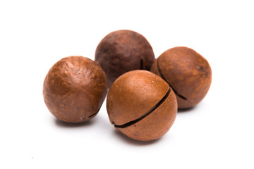 Shelled  macadamia nuts on white background