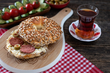 A fresh bagel burger stuffed for breakfast. Simit concept with many appetizer. 
