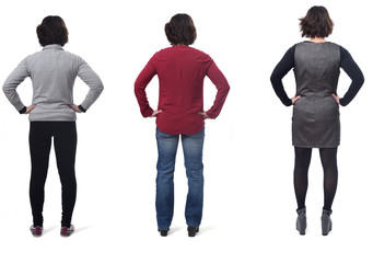 Obraz premium rear view of a woman dressed sporty casual and dress, hands on hip