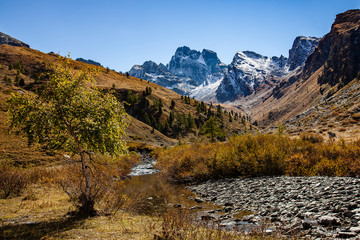 Mountain Monte viso the highest peak (Italian mountain) in Cottian Alps seen from hiking trail in France, Queyras Regional Park. European mountains.