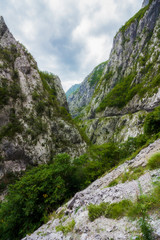 Views of road trough tunnels, canyons, mountains and forests in the Durmitor nature park, Montenegro