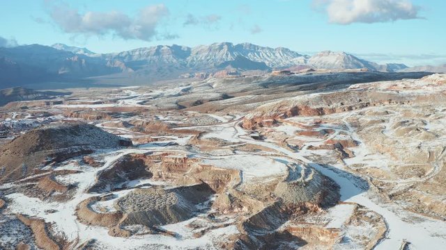 Aerial pullback shot of snow covered gypsum mine quarry near Red Rock Canyon