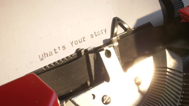 close-up of a vintage typewriter with the text what's your story revealed