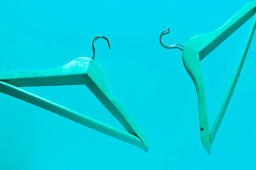 top view of abstract wooden clothes hangers flat lay on color surface