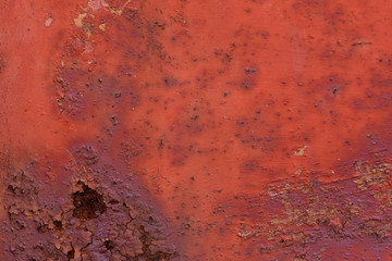 Metal rusty surface with orange color, background texture. Old cracked rusty metal wall pattern. Copy space.
